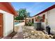 View of the home's exterior and pool area with a brick walkway at 7710 Jackson Springs Rd, Tampa, FL 33615