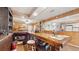 Custom bar features wood paneling, brick accents, and ample display shelving at 7710 Jackson Springs Rd, Tampa, FL 33615
