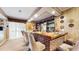 Entertain with ease in this custom bar featuring seating and display shelving at 7710 Jackson Springs Rd, Tampa, FL 33615