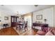 Traditional dining room featuring parquet floors, a chandelier and dark wood furniture at 7710 Jackson Springs Rd, Tampa, FL 33615