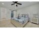 Well-lit bedroom with modern bed, sliding barn door, and decorative accents at 7815 Shadow Run Dr, Largo, FL 33773
