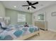 Charming bedroom featuring modern bed, light fixtures, and soothing color palette at 7815 Shadow Run Dr, Largo, FL 33773
