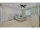 Cozy bedroom featuring modern furniture, a ceiling fan, and light green accents at 7815 Shadow Run Dr, Largo, FL 33773