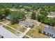 Charming single story home with a front yard and a screened in pool in the backyard at 9259 Marler Rd, Spring Hill, FL 34608