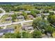 Aerial view of the home in a neighborhood surrounded by trees and other single Gathering homes at 9259 Marler Rd, Spring Hill, FL 34608