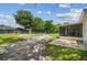Expansive backyard featuring a screened-in porch, large trees, and plenty of space for outdoor activities at 9259 Marler Rd, Spring Hill, FL 34608