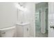 Modern bathroom featuring sleek vanity, updated faucet and tile flooring at 9259 Marler Rd, Spring Hill, FL 34608