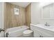 Bathroom boasts tiled shower, a window, and a vanity with a sleek sink at 9259 Marler Rd, Spring Hill, FL 34608