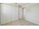 Bedroom features a large closet, neutral walls, tile flooring, and a window at 9259 Marler Rd, Spring Hill, FL 34608