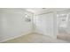Bedroom with closet, neutral walls, tile flooring, and a window at 9259 Marler Rd, Spring Hill, FL 34608
