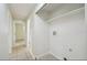 Laundry room featuring tile flooring and shelving for storage at 9259 Marler Rd, Spring Hill, FL 34608
