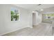 Bright living room with tile floors and a view of the kitchen at 9259 Marler Rd, Spring Hill, FL 34608