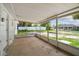 Covered patio offering an outdoor living space with views of the yard and fence at 9259 Marler Rd, Spring Hill, FL 34608