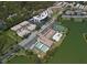 Aerial view of the community showcasing lake views, tennis courts, shuffleboard and a sparkling pool at 10033 64Th N Ave # 4, St Petersburg, FL 33708