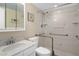 Bathroom with marble countertops, hand rails, and accessible shower at 10033 64Th N Ave # 4, St Petersburg, FL 33708