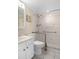 Updated bathroom with safety grab bars, a roll-in shower, and a marble countertop at 10033 64Th N Ave # 4, St Petersburg, FL 33708