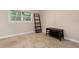 A cozy bedroom featuring tile floors, a window, and a decorative shelving unit at 10033 64Th N Ave # 4, St Petersburg, FL 33708