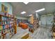 A spacious library with floor to ceiling bookshelves and comfortable seating at 10033 64Th N Ave # 4, St Petersburg, FL 33708