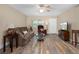 Warm living room featuring wood flooring, a ceiling fan, and comfortable furnishings at 10033 64Th N Ave # 4, St Petersburg, FL 33708