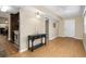 Open living room with light, wood-look floors leading to a kitchen with stainless steel appliances at 10033 64Th N Ave # 4, St Petersburg, FL 33708