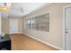 Neutral-toned living space with a large window and light wood-look flooring at 10033 64Th N Ave # 4, St Petersburg, FL 33708