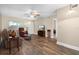 Spacious living room featuring hardwood flooring, a ceiling fan, and natural light at 10033 64Th N Ave # 4, St Petersburg, FL 33708