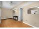 Spacious living area with wood-look floors and neutral tones that lead into the kitchen at 10033 64Th N Ave # 4, St Petersburg, FL 33708