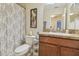 This full bathroom features a shower/tub combination with patterned shower curtain, a vanity, and tile floors at 1012 Seminole Sky Dr, Ruskin, FL 33570