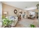 Open-concept living room leading to the dining area, featuring neutral paint and natural light at 1012 Seminole Sky Dr, Ruskin, FL 33570