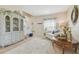 Cozy living room featuring a decorative hutch, staircase, and neutral decor at 1012 Seminole Sky Dr, Ruskin, FL 33570