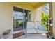 Charming covered patio seating area with comfortable cushions, perfect for outdoor relaxation at 1012 Seminole Sky Dr, Ruskin, FL 33570