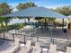 Community playground surrounded by lounging chairs and a lake in the distance at 1012 Seminole Sky Dr, Ruskin, FL 33570