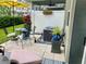 Private patio area with an umbrella, a table with chairs, and stylish accents at 10824 Quickwater Ct, Riverview, FL 33569