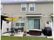 Relaxing back patio with stylish outdoor furniture and a privacy fence at 10824 Quickwater Ct, Riverview, FL 33569