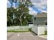 Fenced-in backyard featuring a well-maintained lawn and mature trees for privacy at 10824 Quickwater Ct, Riverview, FL 33569