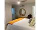 Bedroom featuring neutral colors, ceiling fan, and an ensuite bathroom at 10824 Quickwater Ct, Riverview, FL 33569
