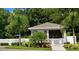 Charming community building surrounded by lush landscaping and a white picket fence at 10824 Quickwater Ct, Riverview, FL 33569