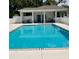 Inviting pool area with ample seating, perfect for relaxing and enjoying the outdoors at 10824 Quickwater Ct, Riverview, FL 33569