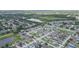 Expansive aerial view of a community neighborhood with lush landscaping and nearby lakes and ponds at 11913 Butler Woods Cir, Riverview, FL 33579