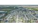This is a view of the neighborhood with pond and green spaces, captured from an aerial perspective at 11913 Butler Woods Cir, Riverview, FL 33579