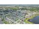 Overhead view of homes nestled in a community with ponds, trees, and well-maintained streets at 11913 Butler Woods Cir, Riverview, FL 33579