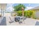 Well-maintained backyard with a shed, palm trees, and an outdoor seating area at 11913 Butler Woods Cir, Riverview, FL 33579