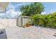 Cozy backyard with a storage shed, brick pavers and tropical landscaping at 11913 Butler Woods Cir, Riverview, FL 33579