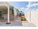 This backyard includes a brick outdoor kitchen, covered patio, and access to a lawnmower at 11913 Butler Woods Cir, Riverview, FL 33579