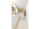 Bathroom with double vanity, decorative mirror, and shower-tub combo at 11913 Butler Woods Cir, Riverview, FL 33579