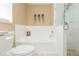 Bathroom featuring tub, shower with glass door, and modern toilet at 11913 Butler Woods Cir, Riverview, FL 33579