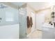 Modern bathroom with glass-enclosed shower, vanity with sink, and neutral color scheme at 11913 Butler Woods Cir, Riverview, FL 33579