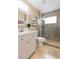 Bathroom featuring a vanity, toilet, and glass-enclosed shower with modern fixtures at 11913 Butler Woods Cir, Riverview, FL 33579