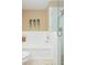 Bright bathroom featuring a tub with decorative plants and shower with glass door at 11913 Butler Woods Cir, Riverview, FL 33579