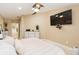 Bedroom featuring neutral color scheme, tv, and natural light at 11913 Butler Woods Cir, Riverview, FL 33579